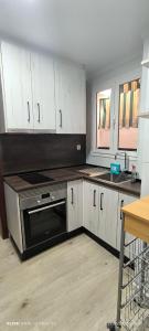 Kuchyň nebo kuchyňský kout v ubytování Fuente de la Villa Apartamento