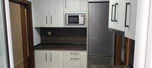 Kuchyň nebo kuchyňský kout v ubytování Fuente de la Villa Apartamento + 9 fotografií