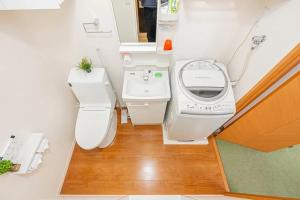 a small bathroom with a toilet and a sink at Akihabara Skytree Premium Apartment 201 in Tokyo +30 photos
