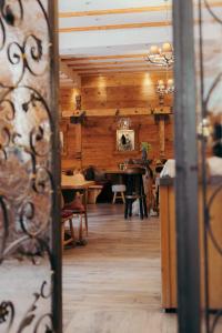 a room with wooden walls and a table and chairs at Seehotel Schlierseer Hof in Schliersee