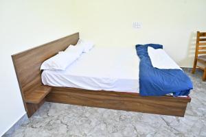 Ένα ή περισσότερα κρεβάτια σε δωμάτιο στο RK Comforts