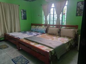 Postel nebo postele na pokoji v ubytování Cecille's Homestay