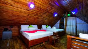 Postel nebo postele na pokoji v ubytování Lion Rock Haven Cabana