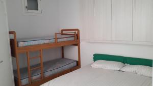 a bedroom with two bunk beds and a bed at Casa Delfino in Chioggia