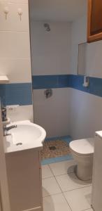 a bathroom with a sink and a toilet at Casa Delfino in Chioggia