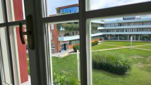 a view from a window of a building at Elegante appartamento vicino al mare a Calambrone in Pisa