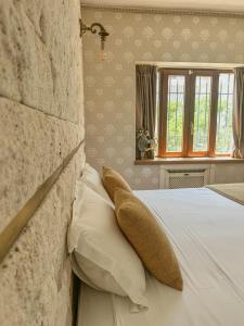 Postel nebo postele na pokoji v ubytování Arunda Luxury Boutique Hotel