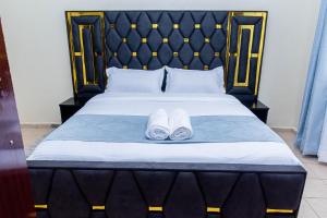 Ένα ή περισσότερα κρεβάτια σε δωμάτιο στο Coles Residence & Suites
