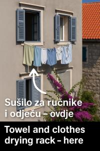 a building with a clothes drying on a balcony at ROKOS SUPERIOR DOWNTOWN ROOMS - comfortable rooms with private bathrooms - perfect location for exploring Diocletian's Palace and the gastronomy of Split within walking distance in Split