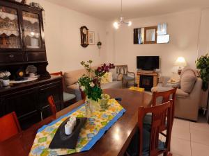 a living room with a dining table and a living room with at CASA PITA Completa Grupos in San Justo de la Vega +34 photos