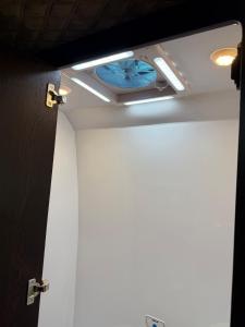 a room with a bathroom with a ceiling light at Hotel auf Räder in Wangen im Allgäu +3 photos