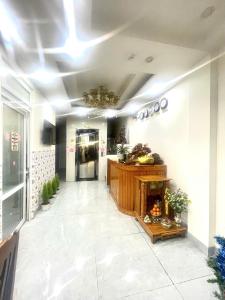 a hallway with a fireplace in a building at DIỄM MY Hostel in Ấp Ðinh An (1)