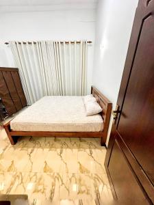Postel nebo postele na pokoji v ubytování Casa Araliya