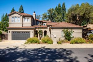 a large house with a garage at Folsom 4BR Retreat - Backyard & Parking in Folsom