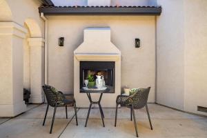 a table and chairs in front of a fireplace at Folsom 4BR Retreat - Backyard & Parking in Folsom +27 photos