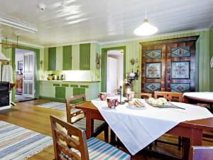 a kitchen and dining room with a table and chairs at Historic Charm in Varmland Oasis-By Traum in Östmark