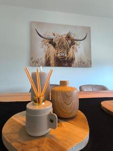 a wooden table with apotion at VILLA VULKANEIFEL -modern -familienfreundlich -Terrasse -Doppelgarage -ruhiger Lage in Darscheid