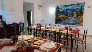 a group of tables and chairs with food on them at Pokoje u Kasi i Marcina in Lipnica Wielka