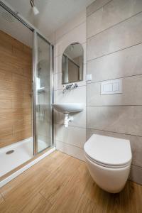 a bathroom with a toilet and a sink and a shower at U Chowańca in Murzasichle +43 photos