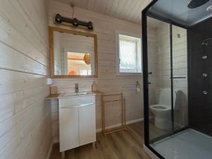 a bathroom with a sink and a toilet at Cabana in Sesimbra +11 photos