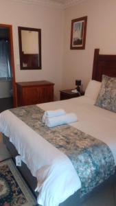 Ένα ή περισσότερα κρεβάτια σε δωμάτιο στο Christland Guest House