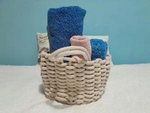 a wicker basket with a pair of shoes in it at Comfy Room With Working Space in top Location in Ivišovo Greblje