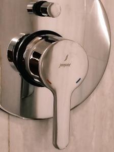 a mirror on the wall of a shower at Omana Hotel in Kathmandu