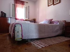 a large bed sitting in a room with at Casa do Ruben Lisboa in Lisbon