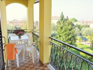a balcony with a table and chairs and a view at Holiday Home in Lazise near Lake Garda in Lazise