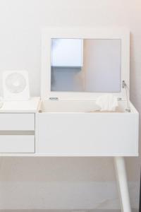 a white desk with a mirror on top of it at Cozy Stay in Seoul +20 photos