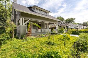a house with a grassy yard at Southern Charm & Modern Comfort in Jacksonville
