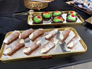 a tray of cookies and cupcakes on a table at V&G palma di montechiaro in Palma di Montechiaro