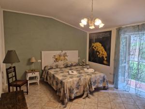 Postel nebo postele na pokoji v ubytování Domus Aromatica, profumo d'Assisi, profumo di casa