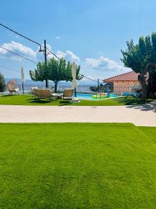 a park with tables and chairs and a grass field at Sesi Luxury Suites Seaside & Private Pool in Marathon