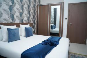 Postel nebo postele na pokoji v ubytování AB Business Hôtel