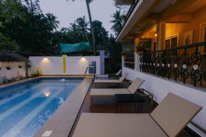 a swimming pool on the balcony of a house at Pvt Pool - Villa Azura Escape - Casa Marialina 8 BR in Saligao