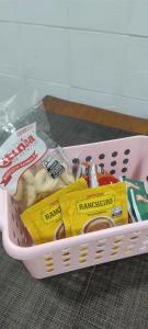a basket filled with donuts and other food at Guest House in Petrópolis in Petrópolis