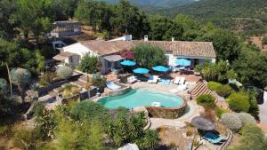 an aerial view of a house with a swimming pool at Villa des Delices in Grimaud
