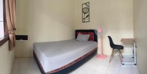 Postel nebo postele na pokoji v ubytování Zahra Guesthouse Shar'i