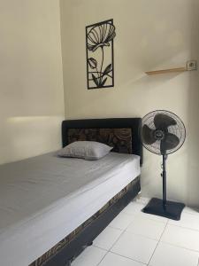 Postel nebo postele na pokoji v ubytování Zahra Guesthouse Shar'i