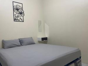 Postel nebo postele na pokoji v ubytování Zahra Guesthouse Shar'i