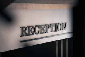 a sign for a rec department store is pictured at a store at Royal View Guest House in Dospat