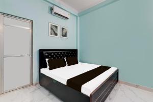 Ένα ή περισσότερα κρεβάτια σε δωμάτιο στο Hotel O Kamla Guest House