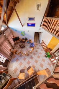 an overhead view of a living room with a table and chairs at Bella Pousada in Rio Forcação