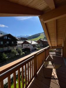a view from the balcony of a house at Baita PierIta Stua Genziana e Ginepro in Bormio +21 photos