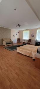 a large room with two large beds in it at Iranija 21 in Daugavpils