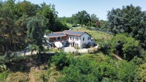 an aerial view of a house on a hill at Tenuta Nissole in Rocchetta Tanaro +35 photos