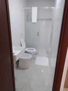 a bathroom with a toilet and a sink and a shower at Euromoon in Rome