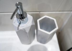 a bathroom sink with a faucet on a counter at Contemporary Two-Bedroom Apartment - Parking, Fast Wi-Fi, Great for Business & Relocation by AV Hughes Properties in Milton Keynes