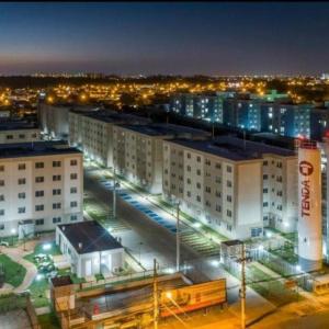 a city at night with buildings and street lights at Apt, espaço inteiro no 1° andar. in Canoas